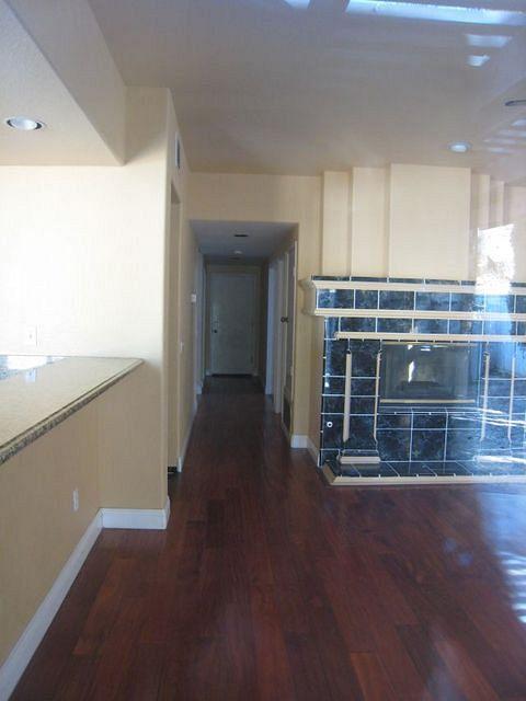 Family room off the Kitchen - hallway to garage and down stairs bedroom